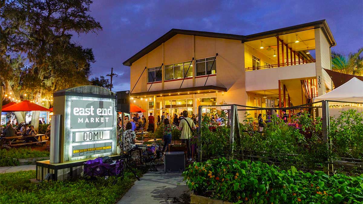 A crowd-filled nighttime view of East End Market